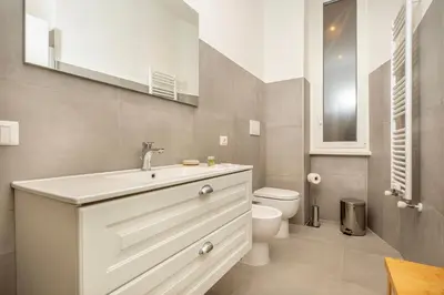 a bathroom with a white sink and a toilet at Roma Borghese - casa vacanze in Rome
