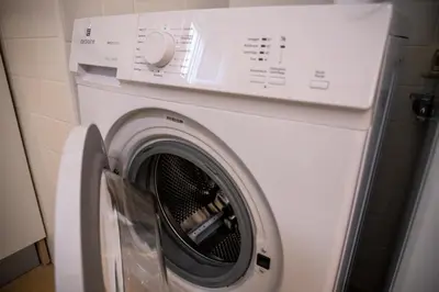 a washing machine in a room with at Statilia 1 Apartment in Rome