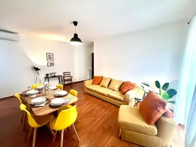 a living room with a table and a couch at Gandino House at Vatican in Rome