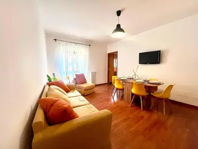 a living room with a couch and a table at Gandino House at Vatican in Rome