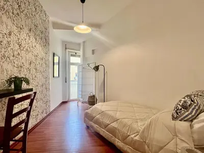 a bedroom with a bed in a room at Gandino House at Vatican in Rome