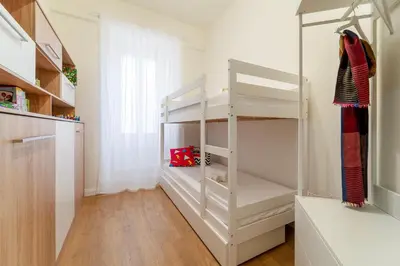 a room with a white closet with shelves at PictaDomus-Albus, Metro Furio Camillo in Rome
