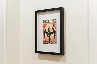 a picture frame with a picture of a woman on it at PictaDomus-Albus, Metro Furio Camillo in Rome
