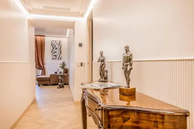 a room with a table with a statue on it at Gianicolo Suites in Rome