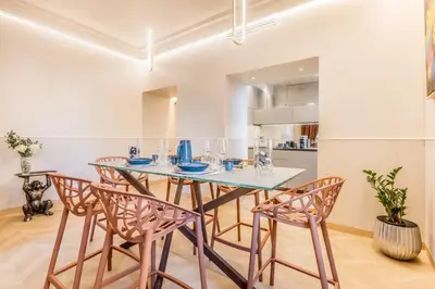a dining room with a table and chairs at Gianicolo Suites in Rome