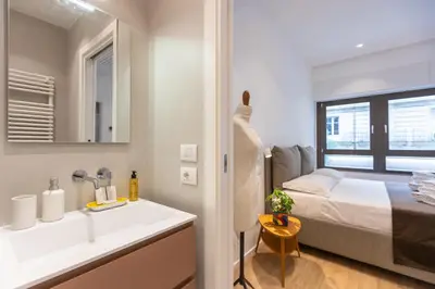 a bathroom with a sink and a bed at Amazing Tacito in Rome