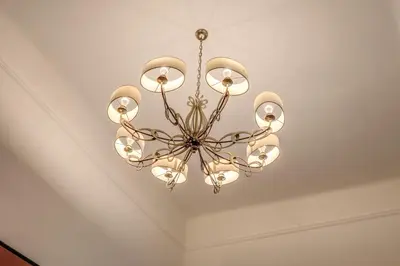 a chandelier hanging from a ceiling in a room at Telier Ripetta in Rome