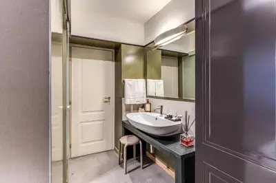 a bathroom with a sink and a mirror at Telier Ripetta in Rome