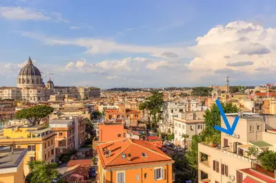 a view of a city with a blue arrow at La terrazza di Vanessa in Rome