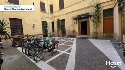 a group of bikes parked outside of a building at Rienzo Charme Apartment in Rome