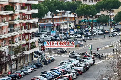 a parking lot full of cars in a city at 15 minuti da San Giovanni - A c, Wifi e Smart Tv in Rome