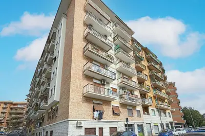 a tall building with balconies on the side of it at 15 minuti da San Giovanni - A c, Wifi e Smart Tv in Rome