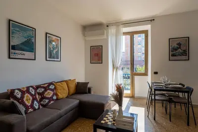 a living room with a couch and a table at Brunetta Cozy Apartment-Metro B in Rome