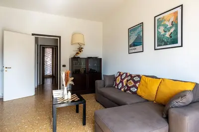 a living room with a couch and a table at Brunetta Cozy Apartment-Metro B in Rome