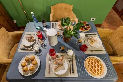a blue table with plates of food and waffles at Fico Giallo - Piazza Navona Apartment in Rome