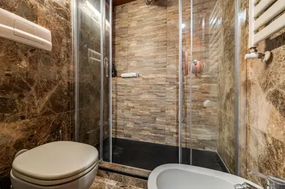 a bathroom with a toilet and a shower at Fico Giallo - Piazza Navona Apartment in Rome