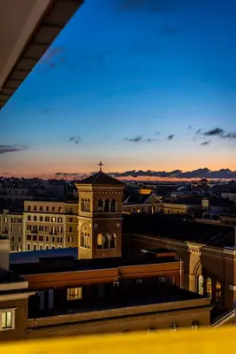 a view of a building with a cross on the top at Lyo Sky Rooms in Rome