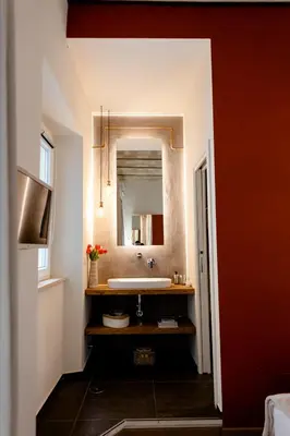 a bathroom with a sink and a mirror at Bruno Domus Colosseo in Rome