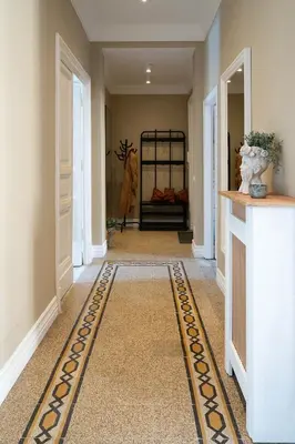 a hallway with a rug on the floor at ROME City Center Apartment III in Rome