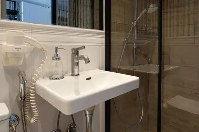 a bathroom with a sink and a shower at ROME City Center Apartment III in Rome