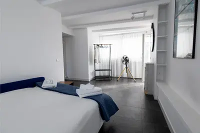 a bedroom with a bed and a tripod in a room at Centrale Attico vista Magnifica sul Vaticano in Rome