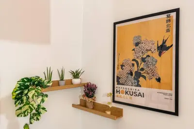a picture of a poster on a wall with plants at Green Central Rome Escape in Rome