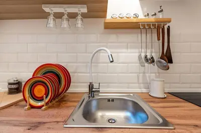 a kitchen counter with a sink in a kitchen at Green Central Rome Escape in Rome