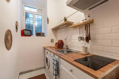 a kitchen with a sink and a counter top at Green Central Rome Escape in Rome