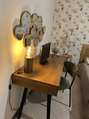 a room with a desk with a computer and mirrors at Retroflatsanlorenzo in Rome