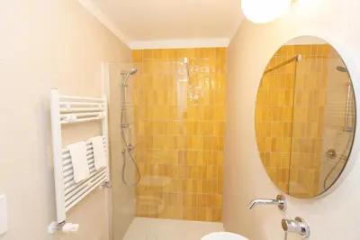 a bathroom with a shower and a mirror at Vatican Colors Rooms in Rome