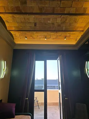 a room with a ceiling with a view of the ocean at Train Station in Rome