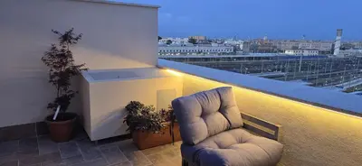 a pair of chairs sitting on top of a balcony at Train Station in Rome