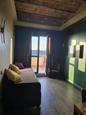 a bedroom with a bed with a view of the ocean at Train Station in Rome