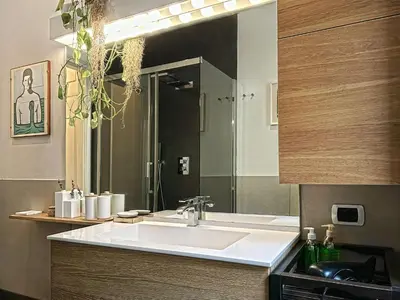 a bathroom with a sink and a mirror at Domus Trevis in Rome