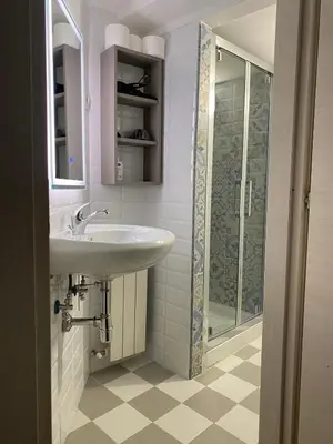 a bathroom with a sink and a shower at 888 Vittorio in Rome