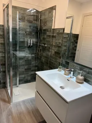 a bathroom with a sink and a shower at Tiburtina Urban Rooms in Rome