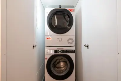 a washing machine and a dryer in a room at Sotto al letto del Papa - Borgo Pio - Vaticano in Rome