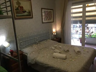 a bedroom with a bed with towels on it at A casa di Simone in Rome