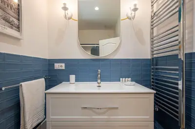 a bathroom with a sink and a mirror at Design Home - Vicino il centro in Rome