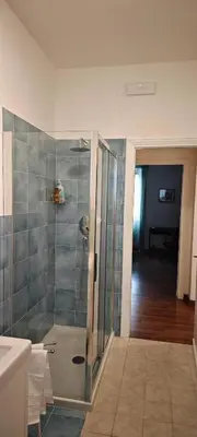 a bathroom with a shower with a sink at San Peter's Gates in Rome