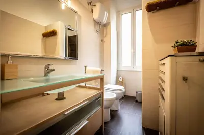 a bathroom with a sink and a toilet at Aradam Luxury Heritage in Rome