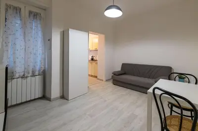a living room with a couch and a table at Delightful Tourist Apartment in Rome