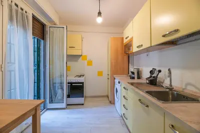a kitchen with a sink and a counter at Delightful Tourist Apartment in Rome