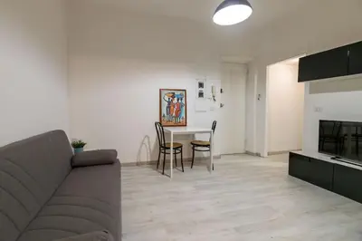 a living room with a couch and a table at Delightful Tourist Apartment in Rome