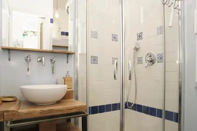 a bathroom with a sink and a shower at Casa Mau - Vacation Vibes in Rome