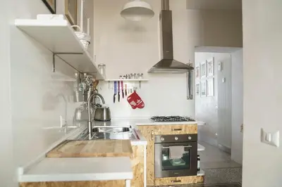 a kitchen with a sink and a stove at Casa Mau - Vacation Vibes in Rome