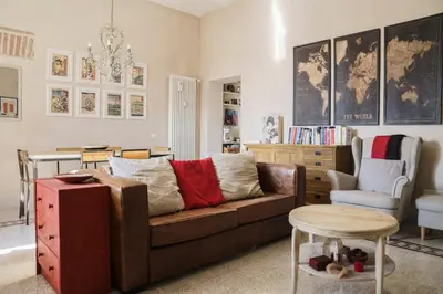 a living room with a couch and a table at Casa Mau - Vacation Vibes in Rome
