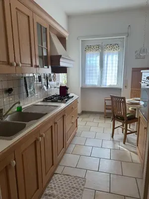 a kitchen with a sink and a stove top oven at Attico Balduina in Rome