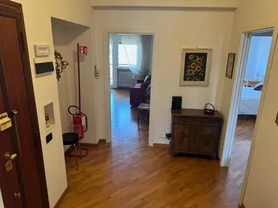 a hallway with a room with a living room at Attico Balduina in Rome