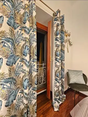 a room with a wall with a blue and white wallpaper at Obelisco Rhome in Rome